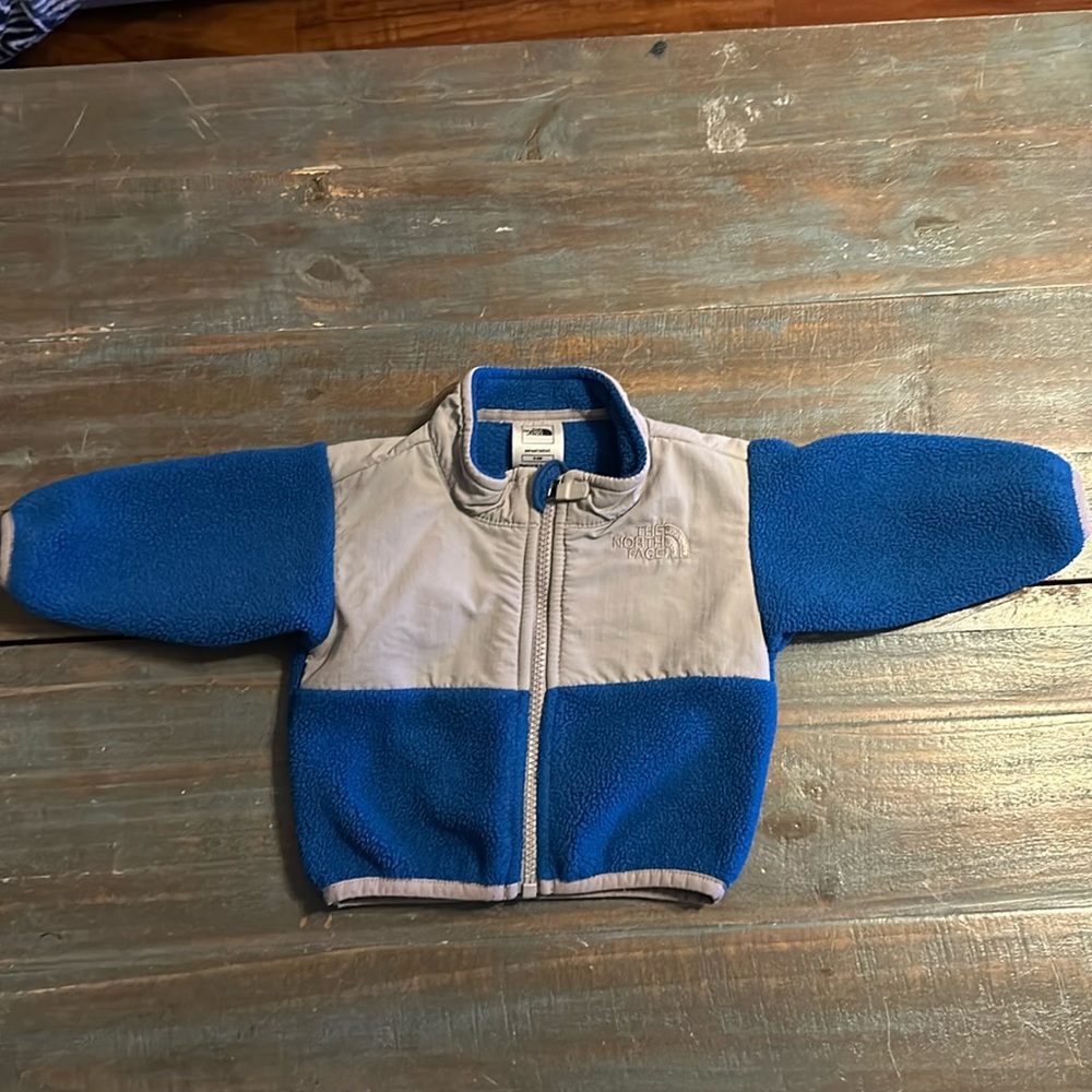 0-3 month gray and blue north face jacket.